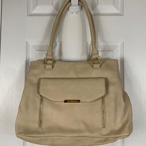 Liz Claiborne cream colored 2 strap handbag. Has 2 outer pockets and 1 Lg one